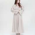 Reverie set in antique beige: bow-sleeve sweater with maxi skirt, front view