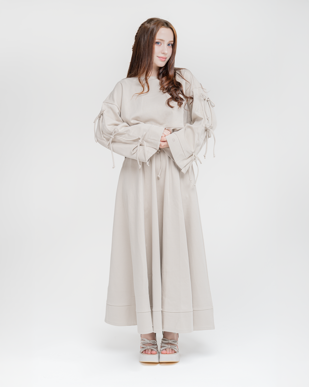 Reverie set in antique beige: bow-sleeve sweater with maxi skirt, front view