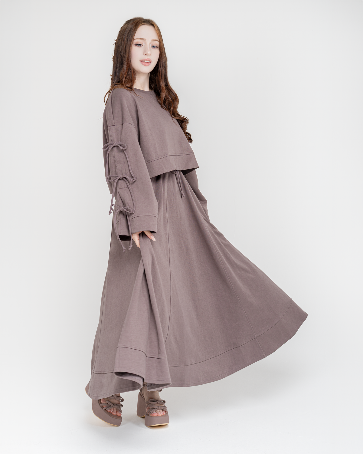 Reverie set in taupe with the maxi skirt in motion, front view