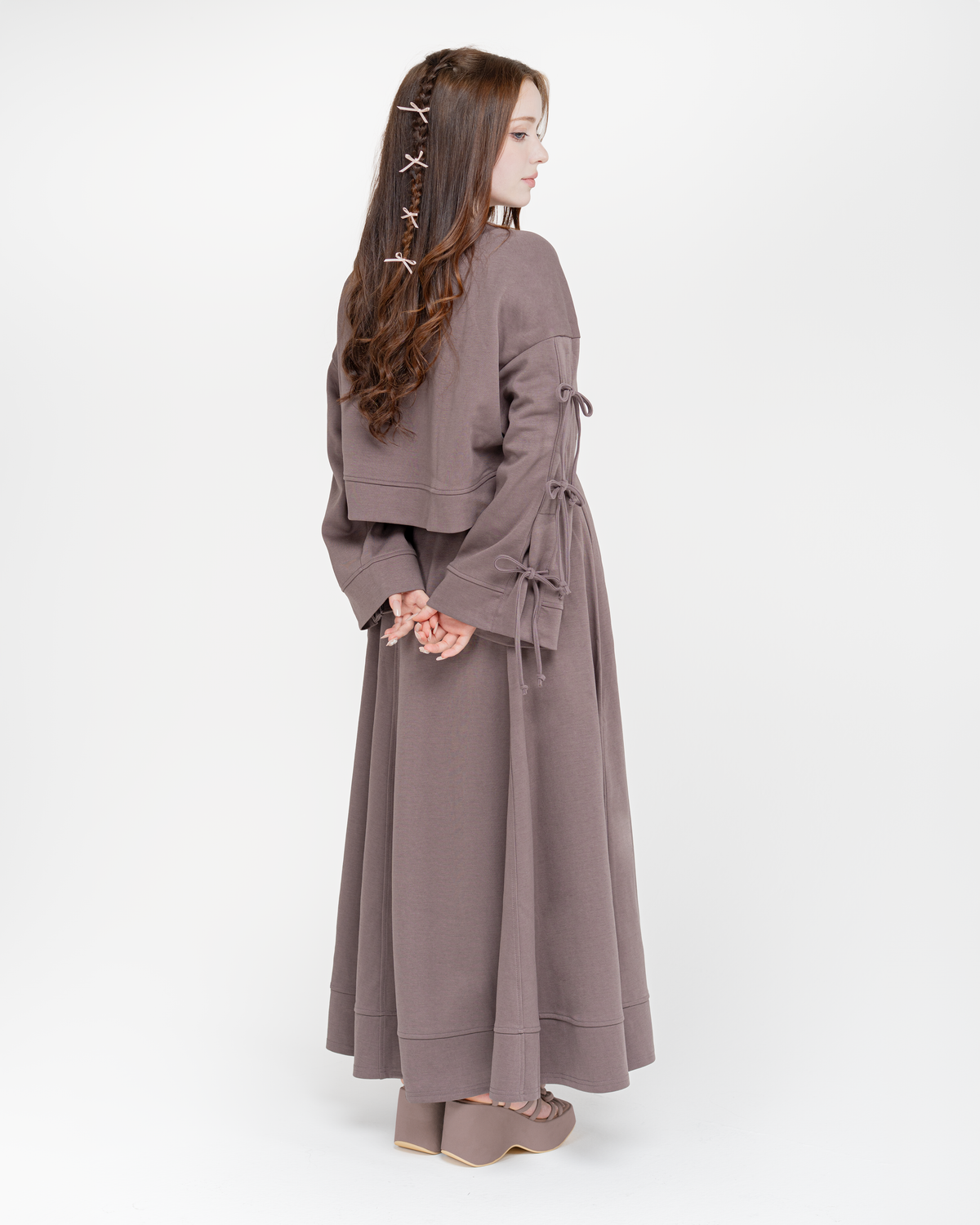 Reverie set in taupe, back view with bow ties along the sleeves